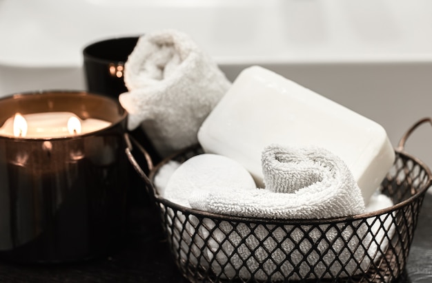 Free photo bath accessories and a burning candle. body care and hygiene concept.