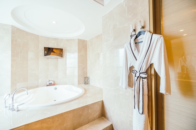 Free photo bathrobe next to a modern bathtub