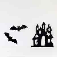 Free photo bats and paper castle on wall