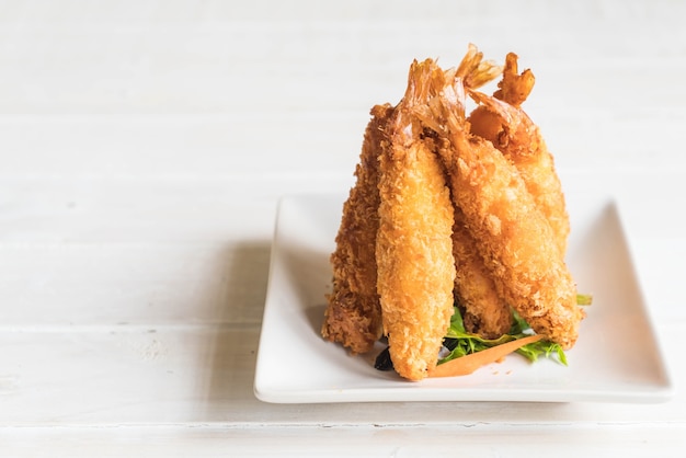 batter-fried prawns on wood