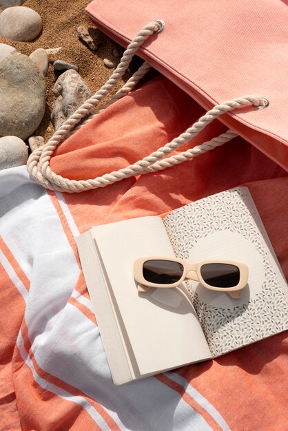 Beach bag with essentials still life