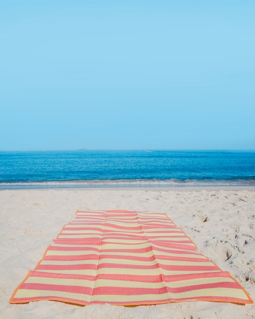 Beach blanket on sand