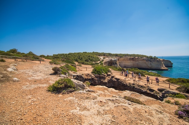  Beach cave of Benagil in Carvoeiro, a popular tourist attraction considered one of the most beautiful beaches of the world. Travel and vacation destinations