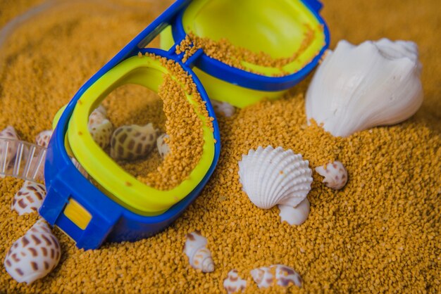 Beach concept with close up view of goggles