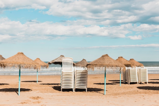 Free photo beach concept with sunshade