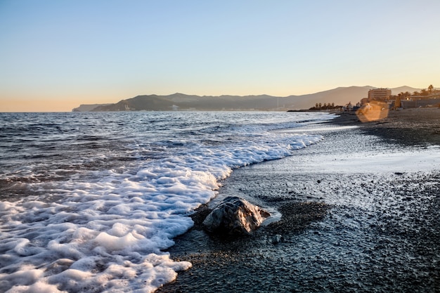 Free photo beach at sunset in savona, italy