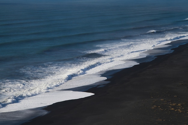 Beach surrounded by the sea under the sunlight in Iceland