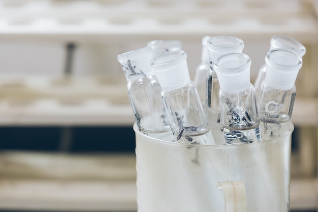 Beakers and equipment on table in factory laboratory