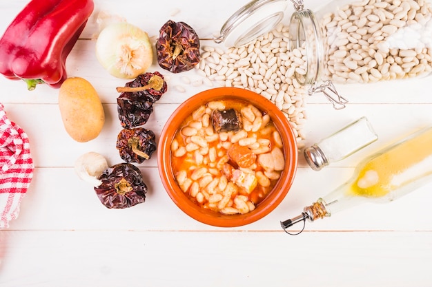 Free photo beans dish with dry vegetables on cooking table