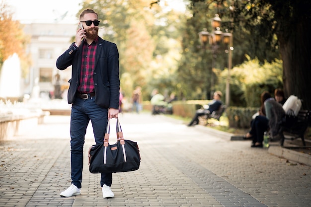 Bearded man with phone