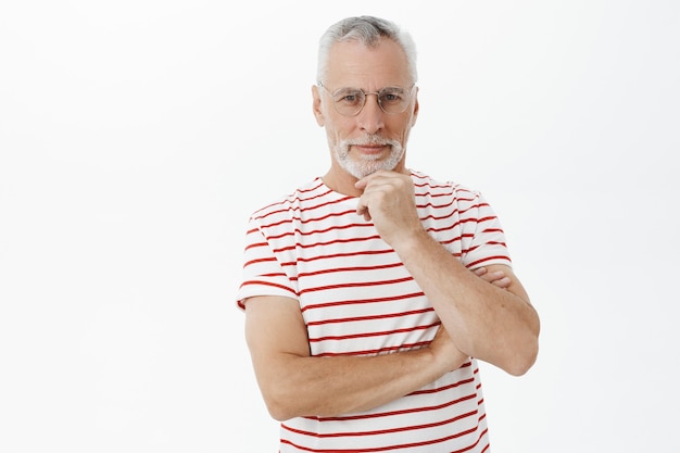 Bearded old man in striped Tshirt