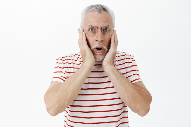 Bearded old man in striped Tshirt