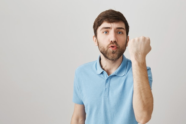 Bearded portrait of a young guy with blue Tshirt