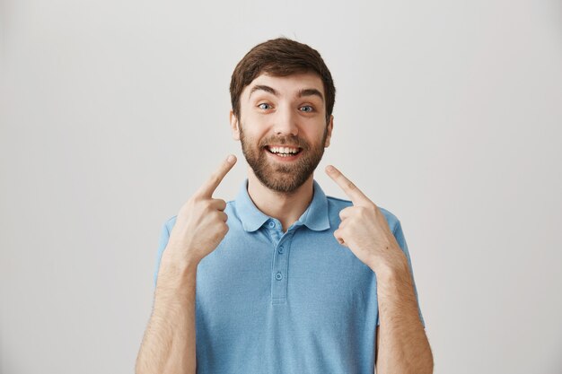 Bearded portrait of a young guy with blue Tshirt