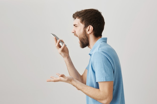 Bearded portrait of a young guy with blue Tshirt