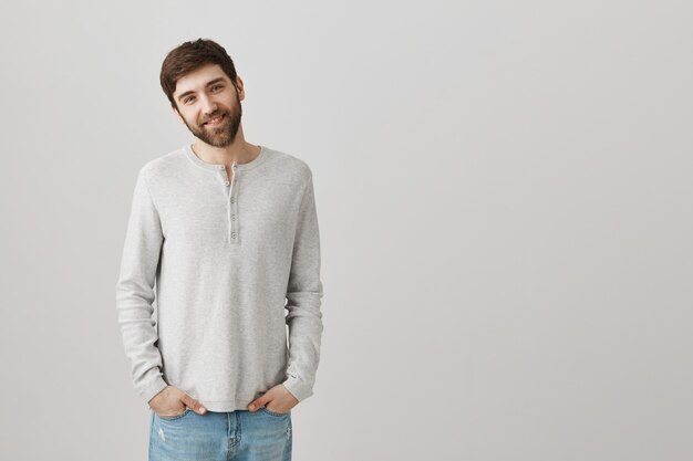 Bearded portrait of a young guy with a white blouse