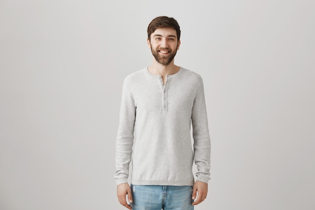 Bearded portrait of a young guy with a white blouse