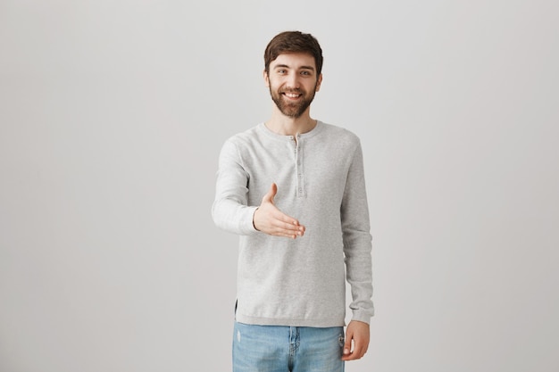 Bearded portrait of a young guy with a white blouse