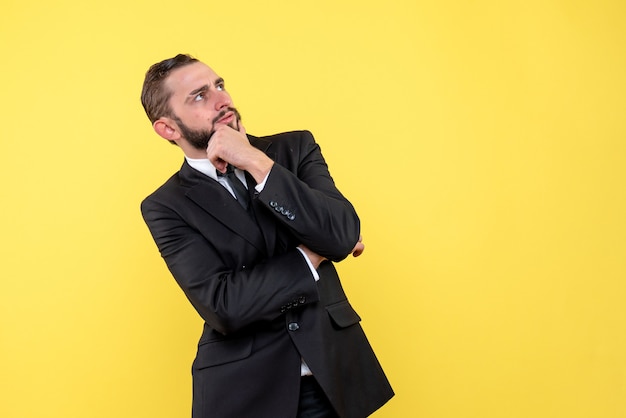 Bearded young man thinking and looking