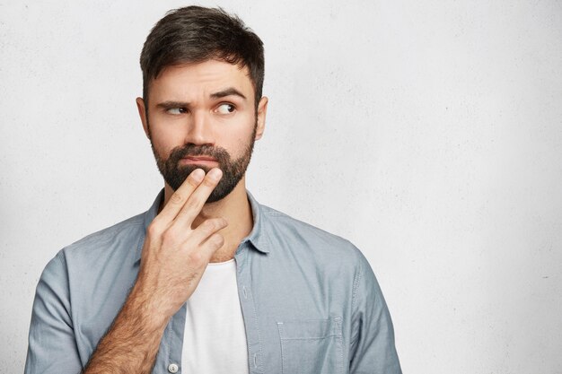 Bearded young man wearing shirt