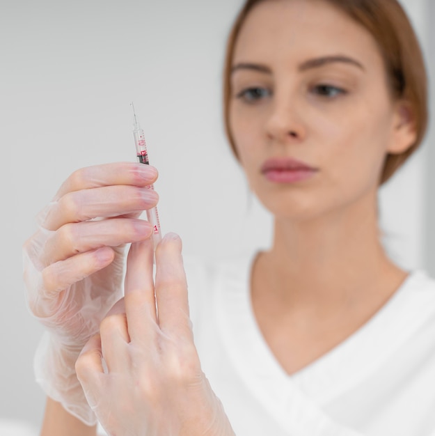 Free photo beautician doing injection filler