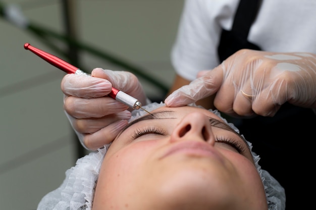 Beautician doing a microblading procedure