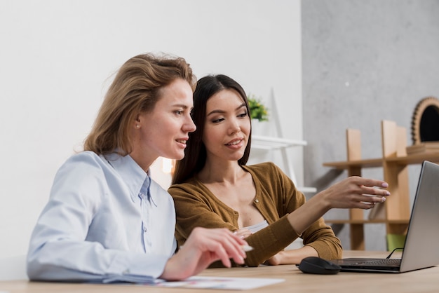 Beautiful adult women planning together