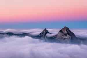 Free photo beautiful aerial shot of fronalpstock mountains in switzerland under the beautiful pink and blue sky