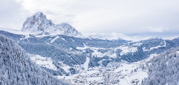 Free photo beautiful aerial view of a ski resort and a village in a mountains landscape, in the alps