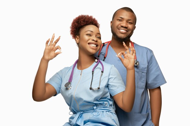 Beautiful african-american doctor couple on white