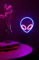 Free photo beautiful alien neon sign in bedroom