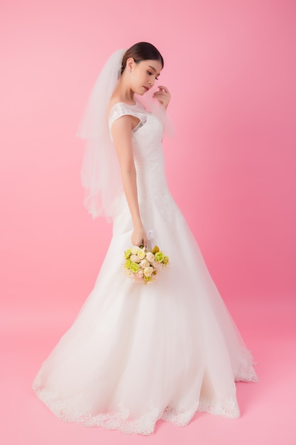 Beautiful asian bride portrait in pink 