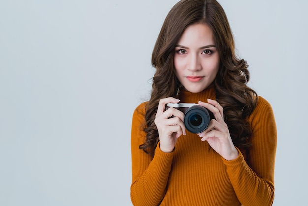 Beautiful asian woman traveller tourist taKe photo with happiness and joyful moment isolate white background