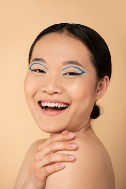 Beautiful asian woman wearing blue eyeliner