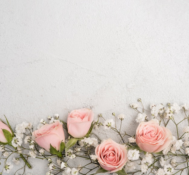 Beautiful assortment of pink roses buds and white flowers