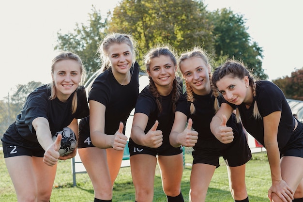 Beautiful athletic women showing ok sign