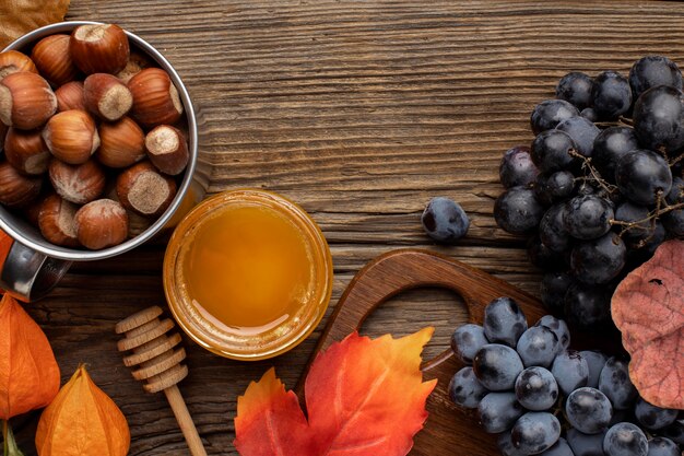 Beautiful autumn arrangement with nuts and grapes