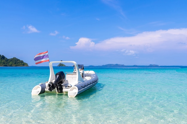 beautiful beach view Koh Chang island and boat for tourists seascape at Trad province Eastern of Thailand on blue sky background 