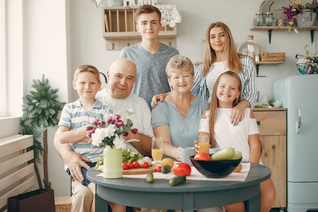 Free photo beautiful big family prepare food in a kitchen