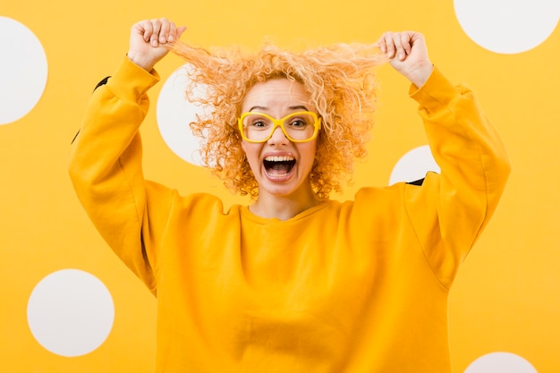 Beautiful blonde woman with yellow glasses