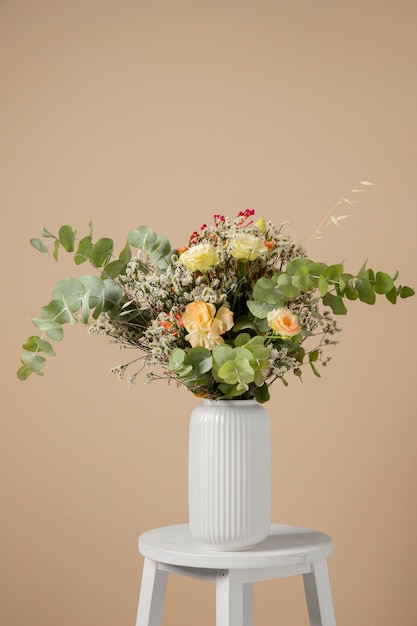 Beautiful boho flowers assortment on white chair