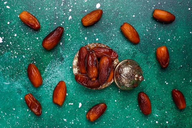 Beautiful bowl full of date fruits symbolizing Ramadan, top view