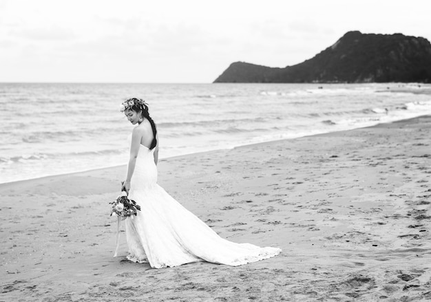 Free Photo beautiful bride by the sea