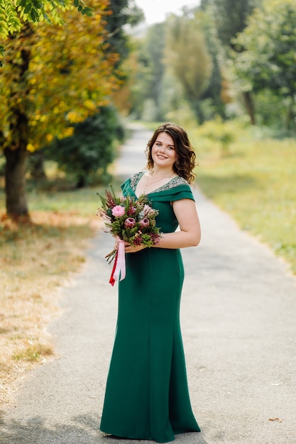 Free photo a beautiful bride wearing green wedding dress