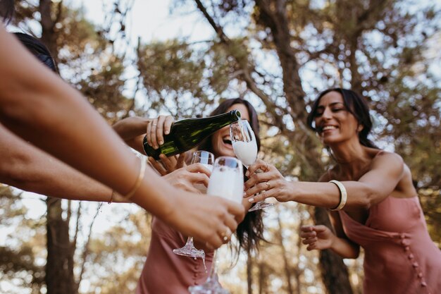 Beautiful bridesmaids having fun outdoors