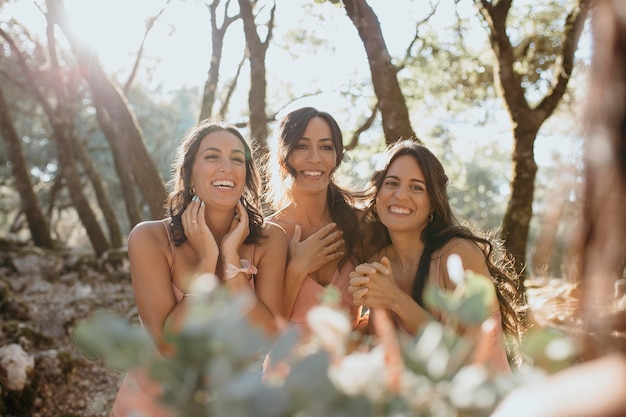 Free Photo beautiful bridesmaids in pretty dresses outdoors