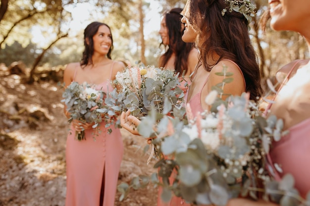 Free Photo beautiful bridesmaids in pretty dresses outdoors