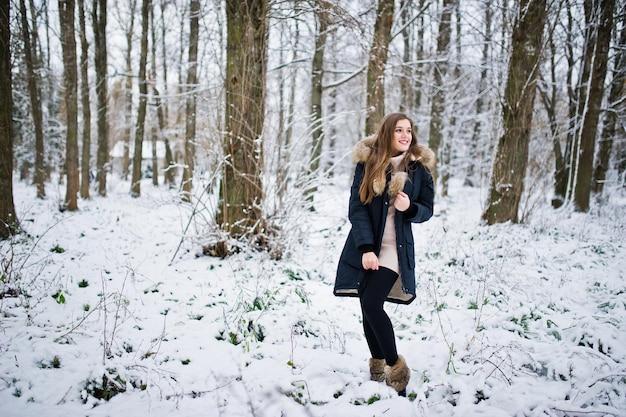 Beautiful brunette girl in winter warm clothing Model on winter jacket