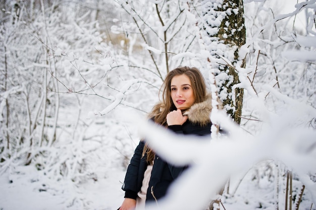 Free Photo beautiful brunette girl in winter warm clothing model on winter jacket