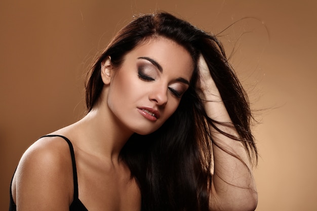 Beautiful brunette with evening makeup